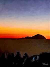 Island of Alicudi silhouetted against a glowing Sicilian sunset with orange and violet sky. Artwork by Rosalie Powell.