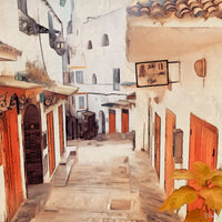 Painting of a quiet Moroccan alley with white buildings, red doors, wrought-iron lanterns, and a sign in Arabic. Sunlight gently brightens the stone street and a leafy plant in the foreground.