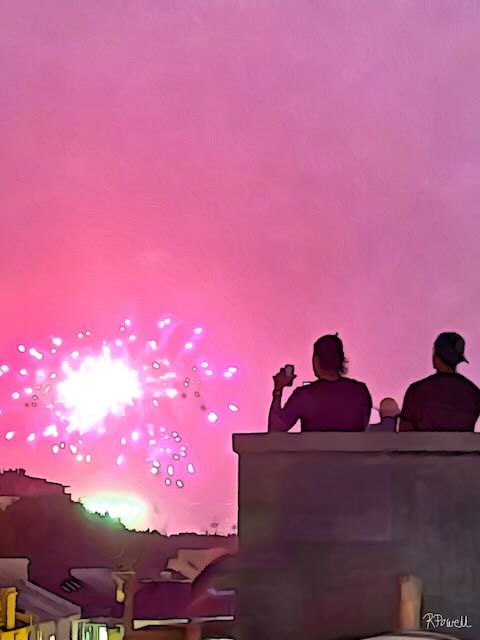 Two people sitting on a rooftop at dusk, watching bright pink and white fireworks light up the sky over Potts Point. The following images feature the same artwork in different interior settings.