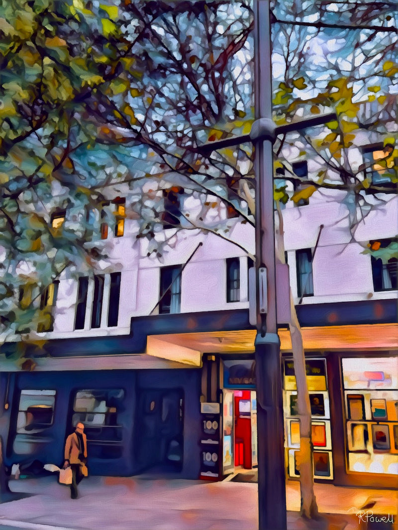 Evening street scene with autumn leaves, a warmly lit shopfront, and a lone figure walking past carrying bags, evoking a quiet, everyday moment. Same image in all following but in assorted interior settings.